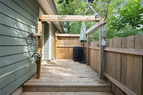 a view of entryway with wooden floor and stairs