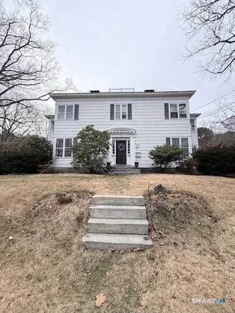a front view of a house with a yard