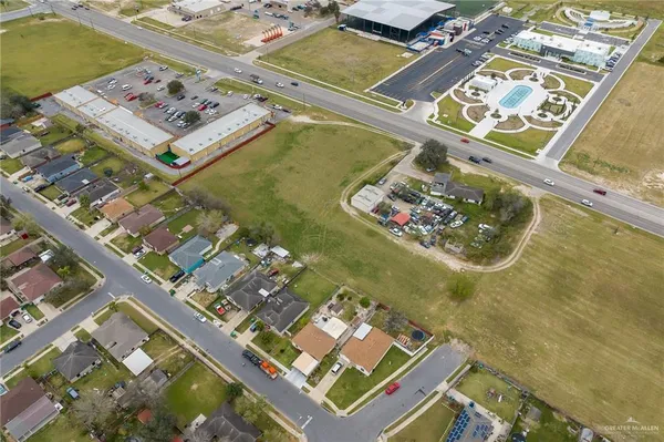 an aerial view of a residential building with an ocean view