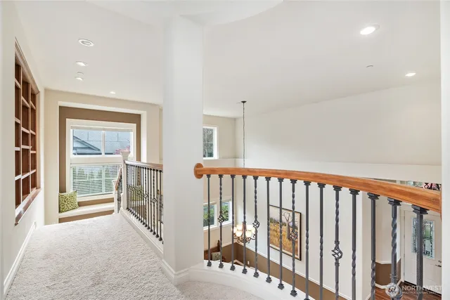 a view of a hallway with windows