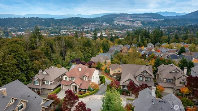 an aerial view of residential house with parking