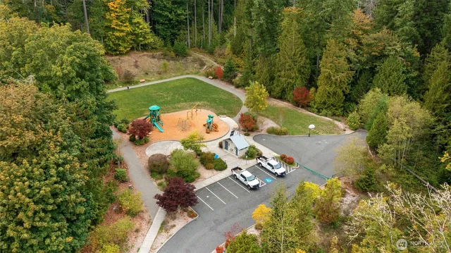 an aerial view of a house with a yard