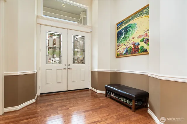 a view of workspace with wooden floor and cabinet
