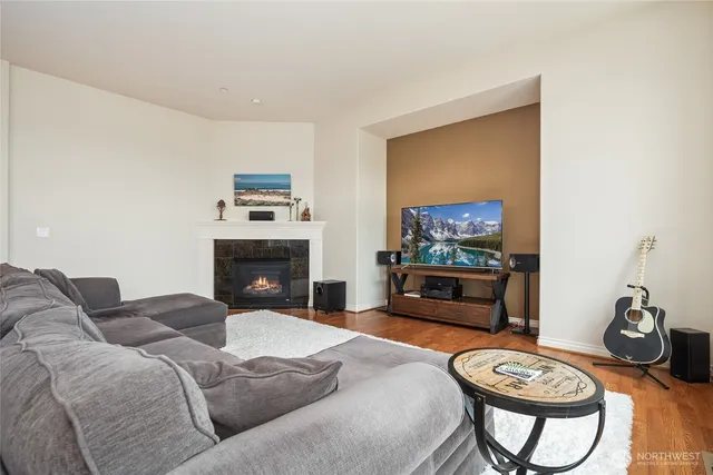 a bedroom with furniture and a flat screen tv