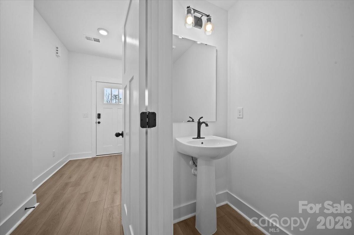 47 Moon Hvn Way Arden, NC 28704 - Photo 12 of 30 a bathroom with a sink a toilet and shower