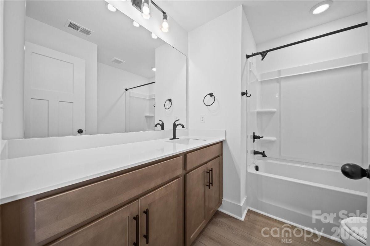 47 Moon Hvn Way Arden, NC 28704 - Photo 22 of 30 a bathroom with a tub sink and mirror