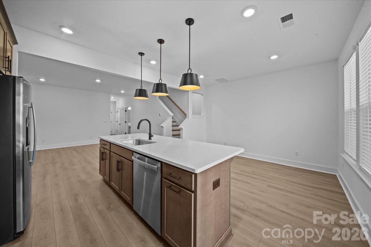 47 Moon Hvn Way Arden, NC 28704 - Photo 6 of 30 a kitchen that has a sink a stove and a wooden floor