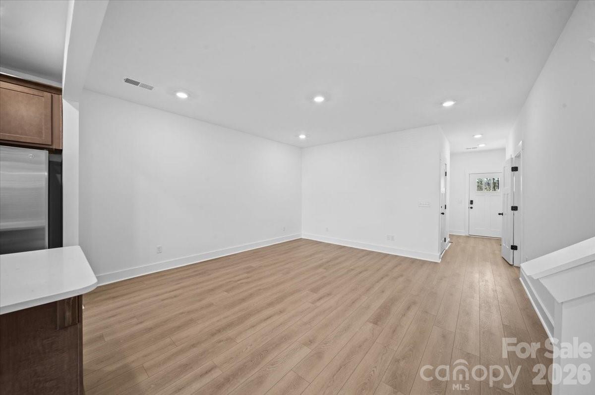 47 Moon Hvn Way Arden, NC 28704 - Photo 10 of 30 a view of an empty room with wooden floor and a window