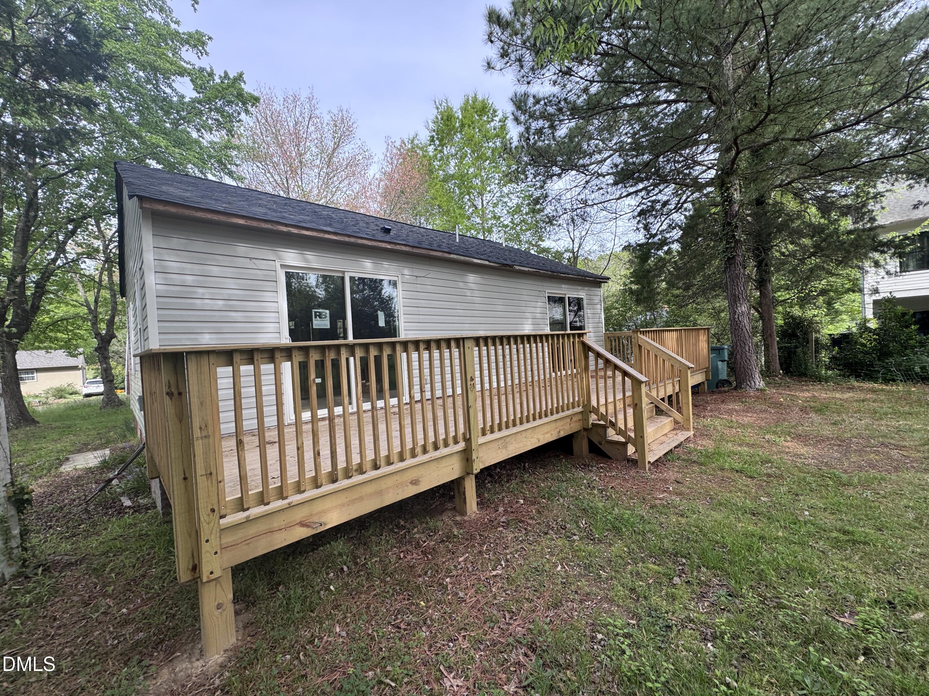 1507 Echo Road Durham, NC 27707 - Photo 5 of 13 a view of backyard with deck and trees