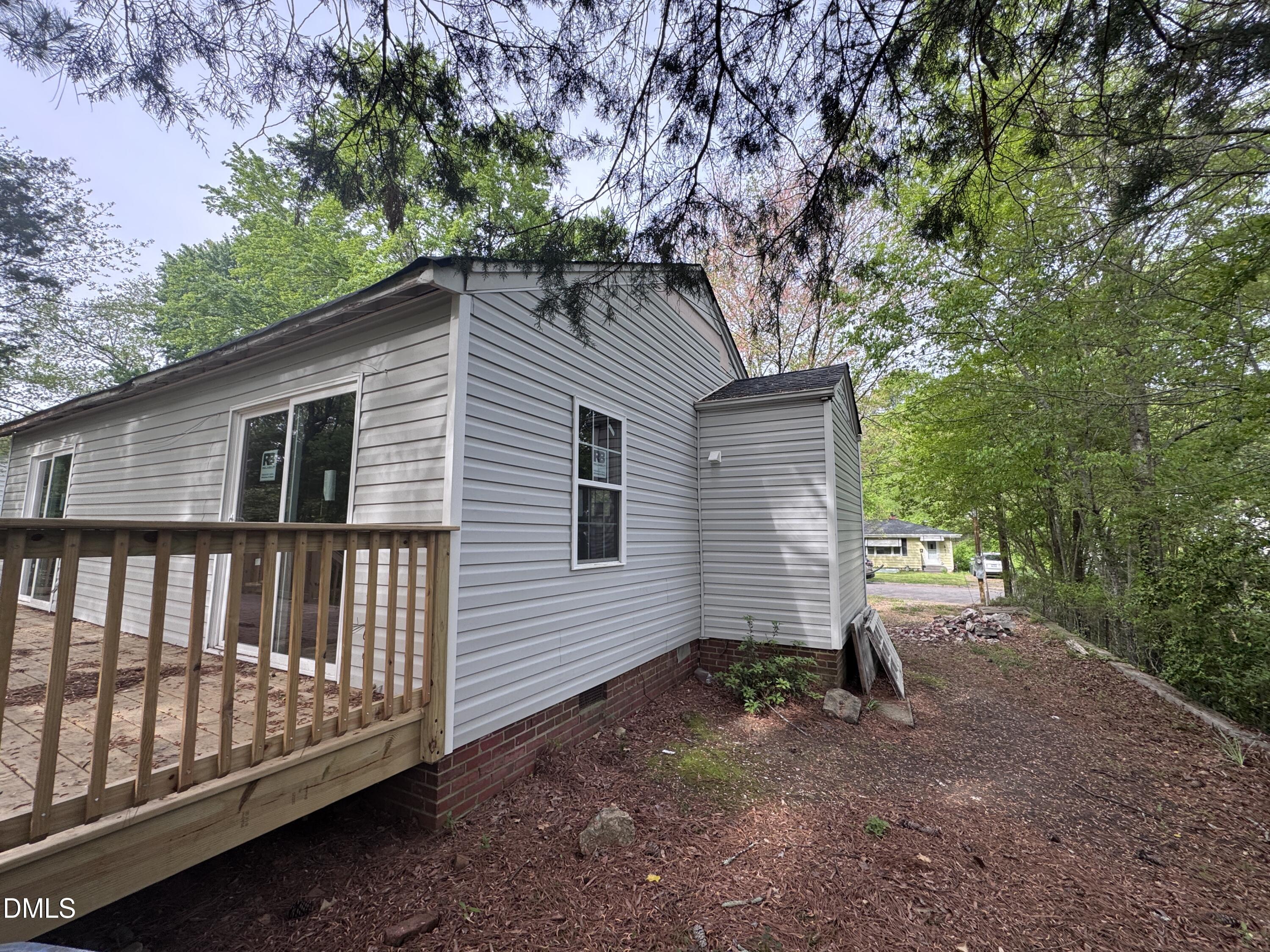 1507 Echo Road Durham, NC 27707 - Photo 6 of 13 a view of backyard with a large tree