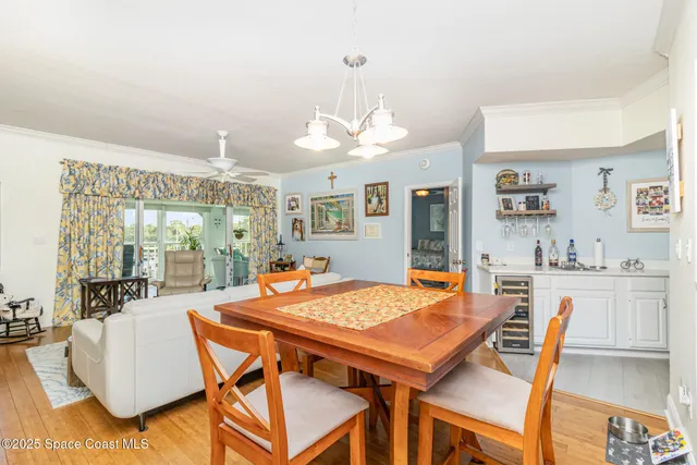 a living room with furniture a flat screen tv and a large window