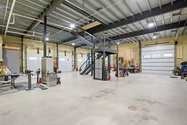a kitchen with a stove a sink and a window