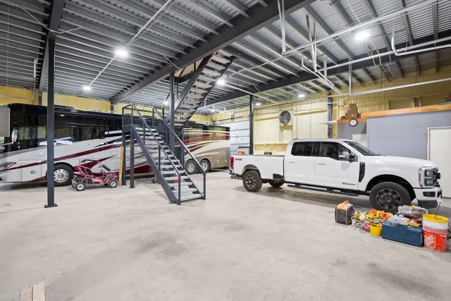 a view of a garage with cars