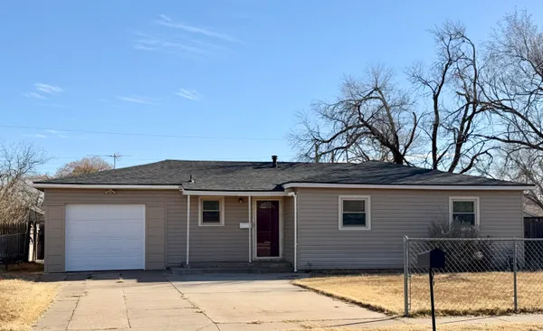 a front view of a house with garage