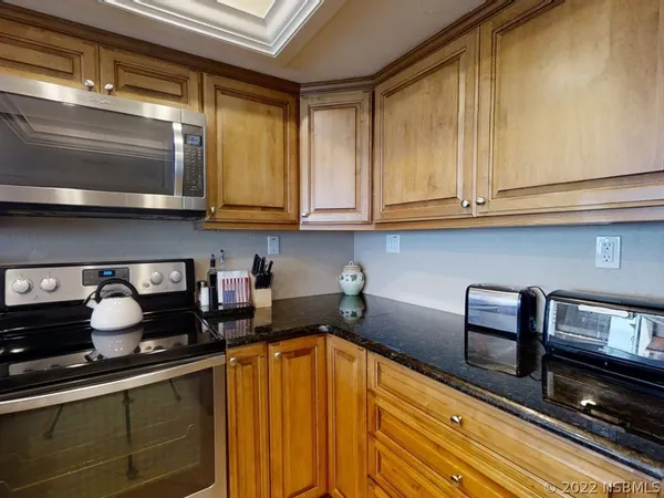 a kitchen with sink a counter space and cabinets
