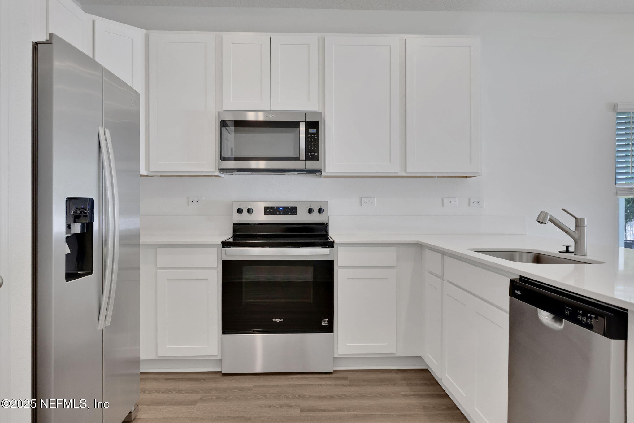720 Sailor Grove Lane Jacksonville, FL 32221 - Photo 11 of 32 a kitchen with stainless steel appliances a stove microwave and refrigerator