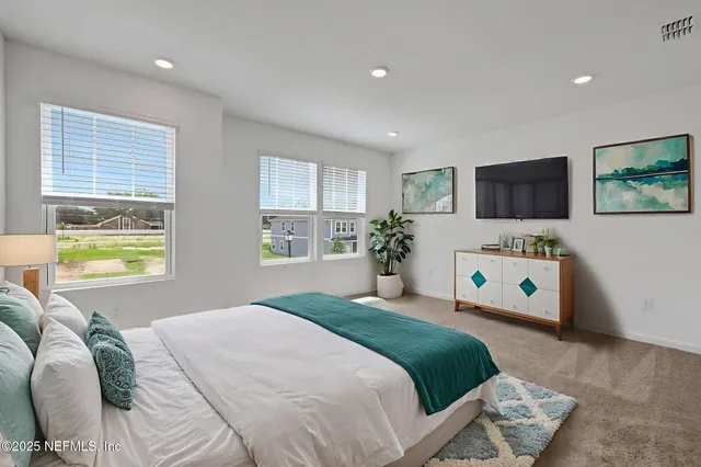 a view of swimming pool with a garden and seating area