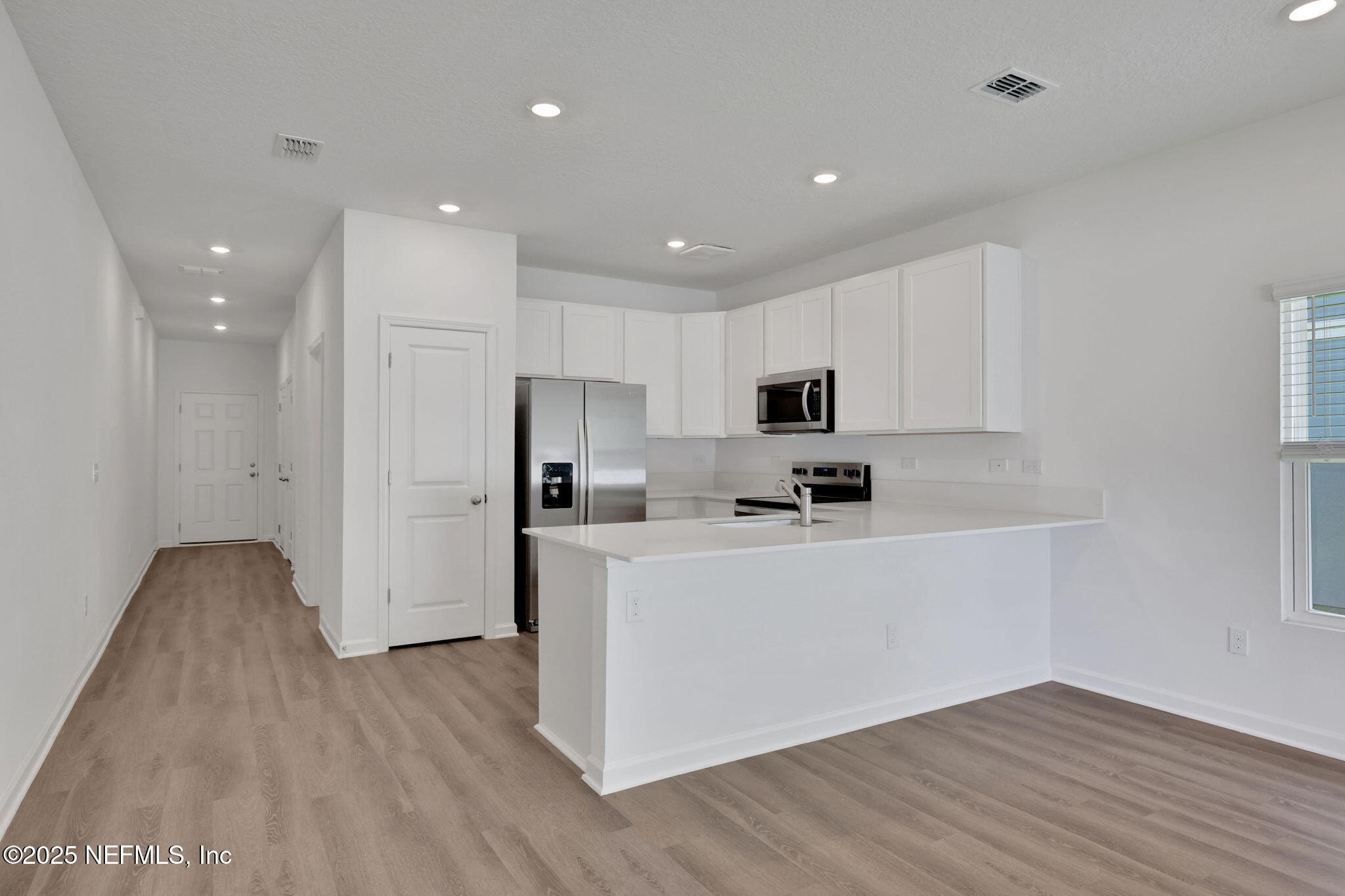 720 Sailor Grove Lane Jacksonville, FL 32221 - Photo 10 of 32 a view of kitchen with stainless steel appliances refrigerator sink and microwave