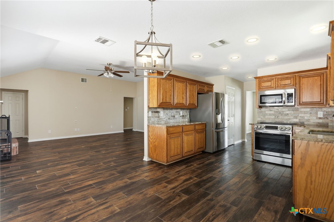 2208 Stonecrest Path New Braunfels, TX 78130 - Photo 9 of 23 Breakfast area open to living room
