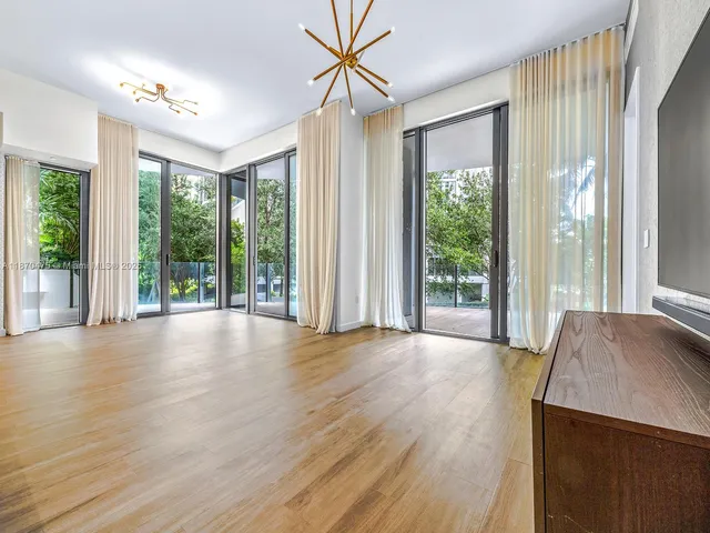 a view of room with window and hardwood floor