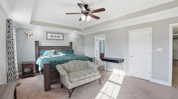 a bedroom with a bed and a couch