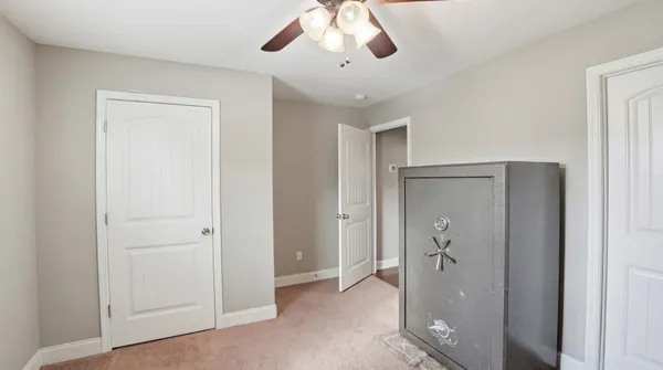 a bathroom with a sink vanity mirror and toilet