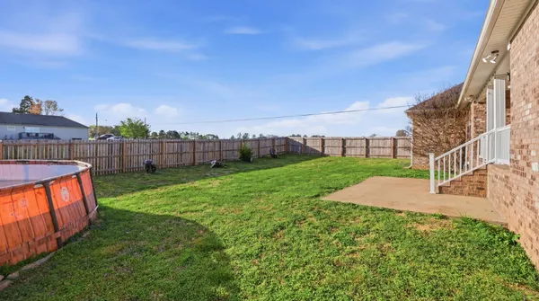 a view of a house with a yard porch and sitting area