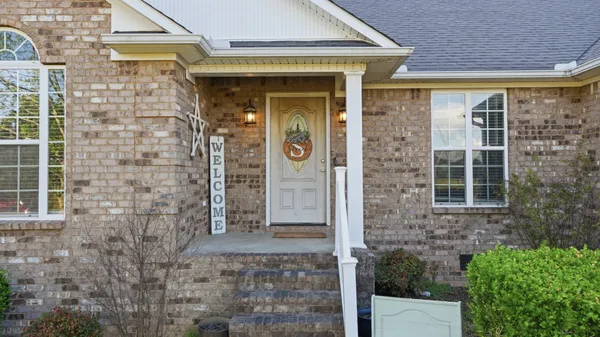 a front view of a house with a glass door