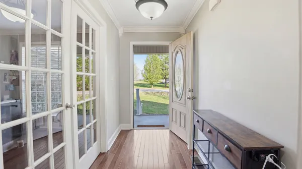 a view of balcony with wooden floor