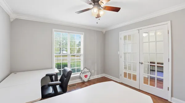 a bedroom with furniture and a window