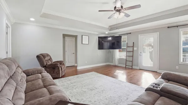 a living room with furniture and a flat screen tv