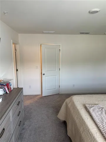 a bed room with furniture and a window