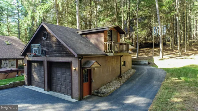 a kitchen with stainless steel appliances a white table chairs and a refrigerator