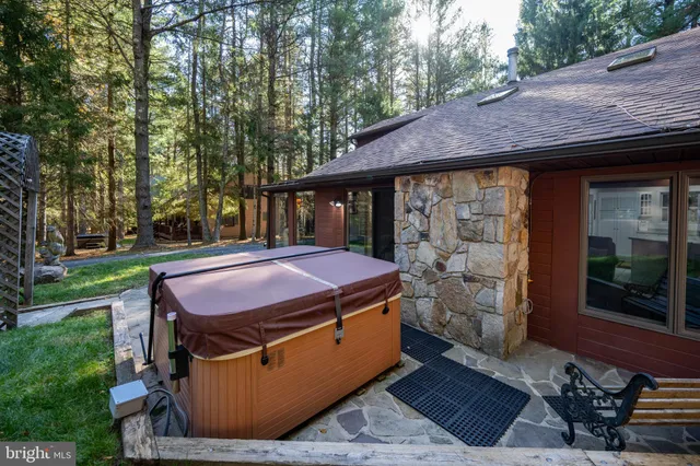 a living room with furniture a fireplace and a window