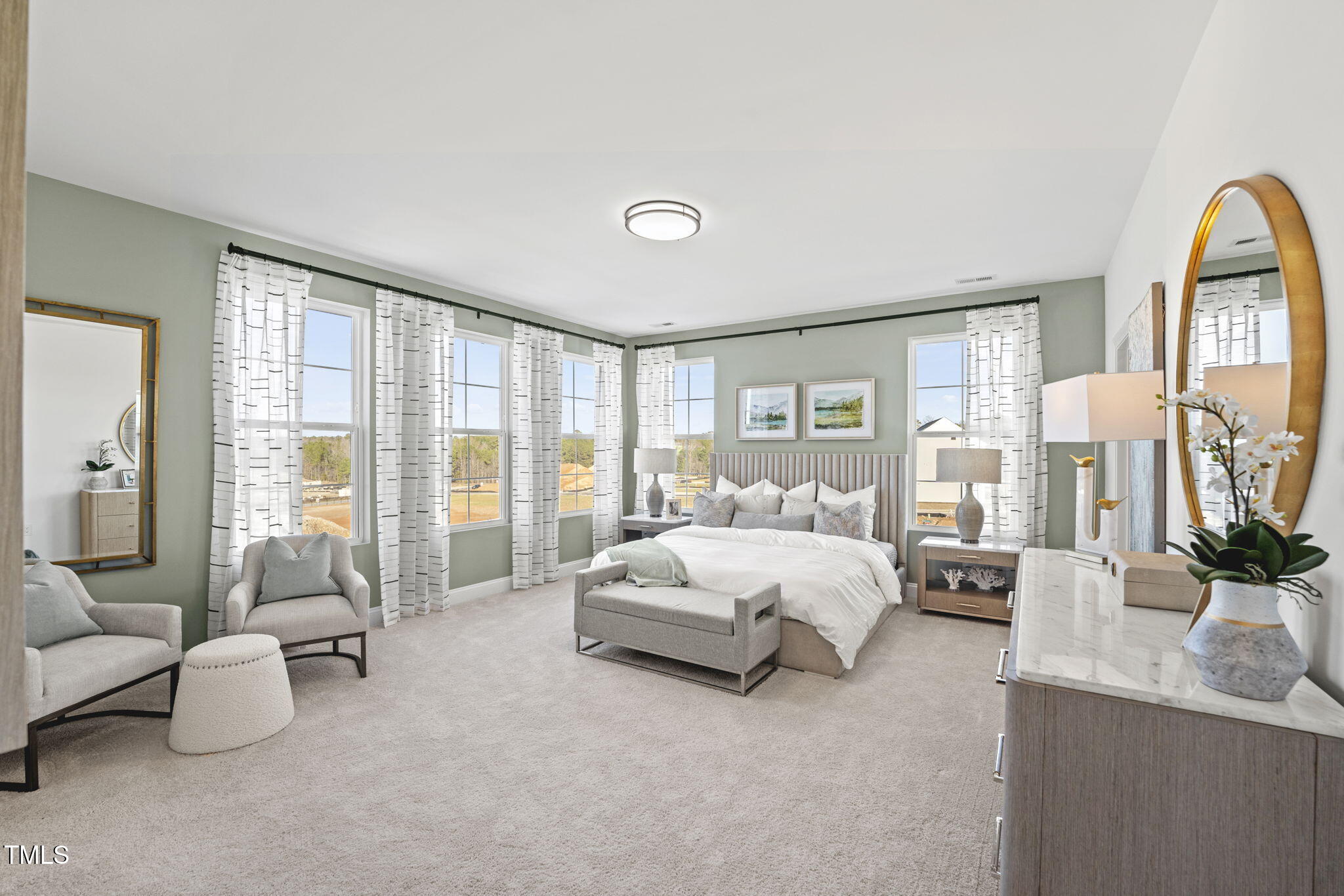 1242 Coach Sta Alley, Unit 201 Raleigh, NC 27601 - Photo 9 of 22 a spacious bedroom with a bed and glass walk in closet