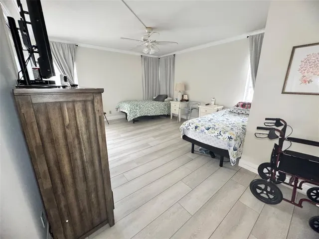 a bedroom with bed and a window