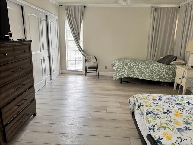 a bathroom with a sink a toilet a mirror and shower curtain