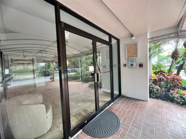 a room with sliding glass door and glass door