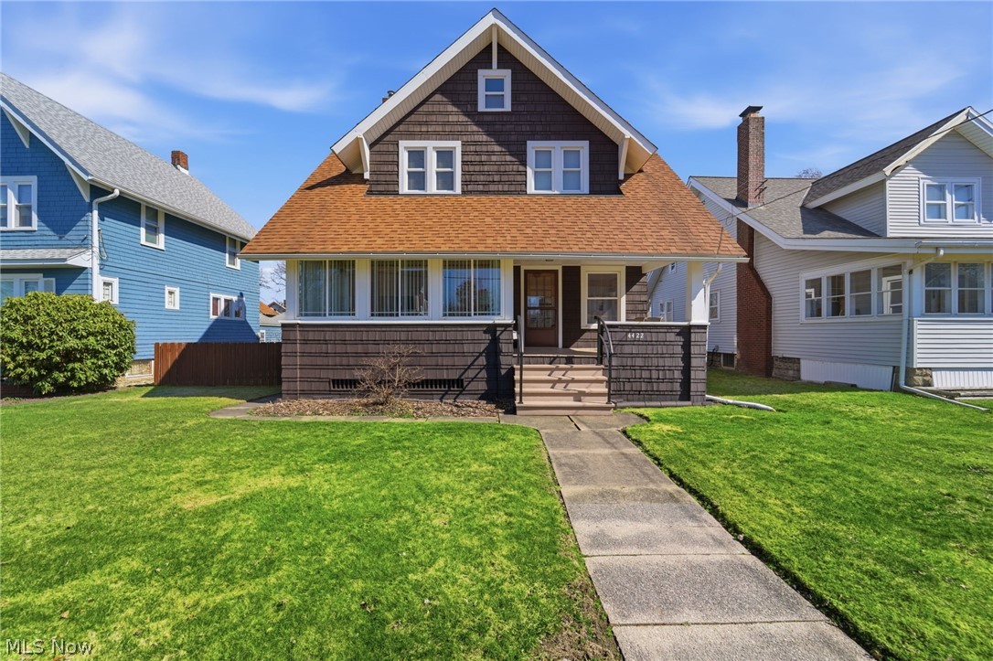 4422 State Road Ashtabula, OH 44004 - Photo 1 of 21 Bungalow with a shingled roof, covered porch, and a front lawn