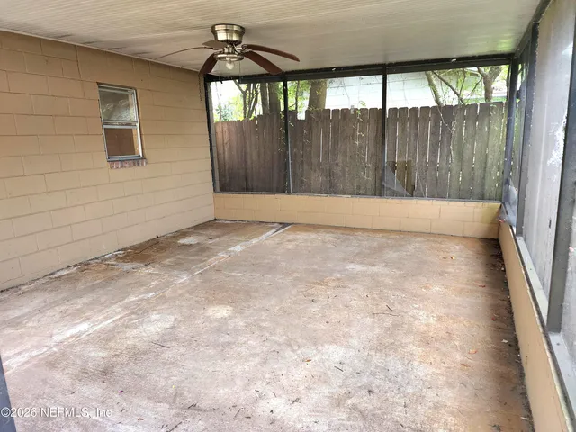 a view of an empty room with a window