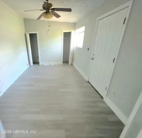 a view of a hallway with a white walls