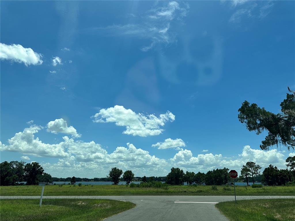 Ranch Gate Boulevard Umatilla, FL 32784 - Photo 14 of 33 a view of a golf course with yellow lighting