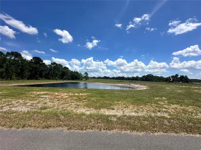 a view of a lake in middle of the house