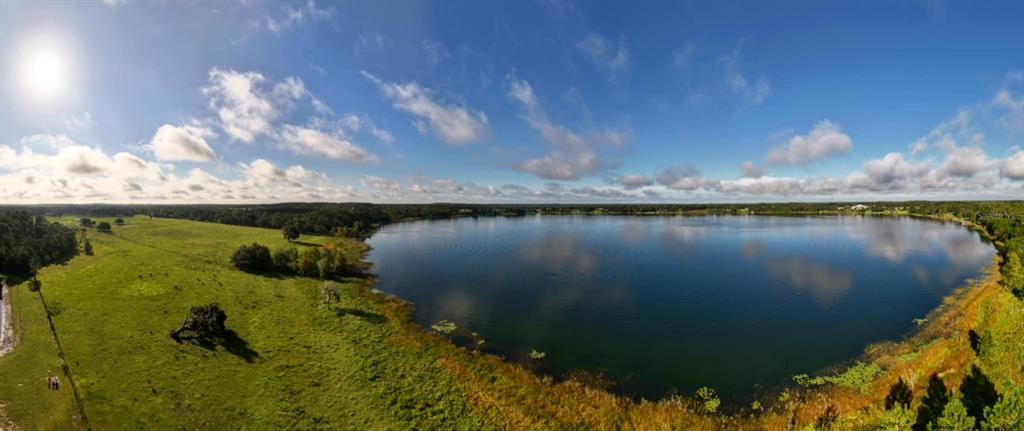 Ranch Gate Boulevard Umatilla, FL 32784 - Photo 2 of 33 a view of a lake in middle of the house