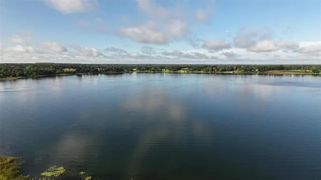 a view of a lake with beach