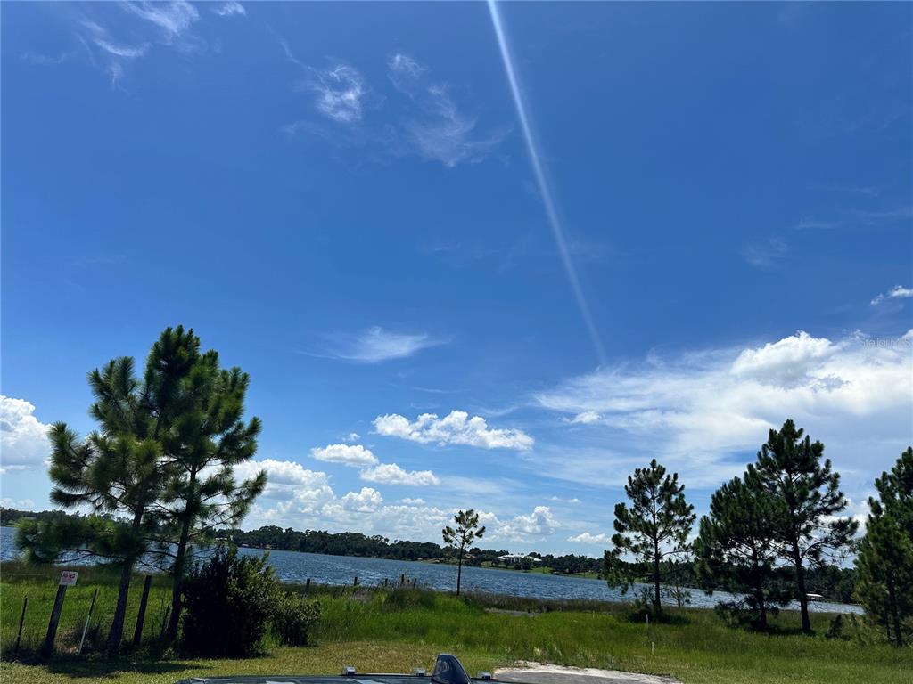 Ranch Gate Boulevard Umatilla, FL 32784 - Photo 28 of 33 a view of a lake with houses in the background