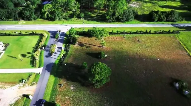 a view of a lake with a yard