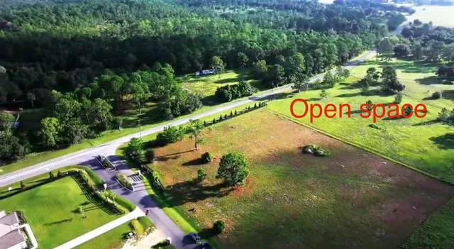 a view of a street with a park