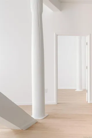 a view of a livingroom with wooden floor