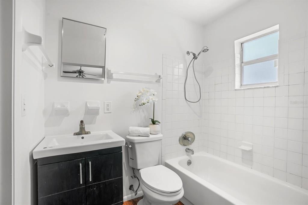720 West Webster Avenue Winter Park, FL 32789 - Photo 11 of 22 a bathroom with a sink a toilet and shower